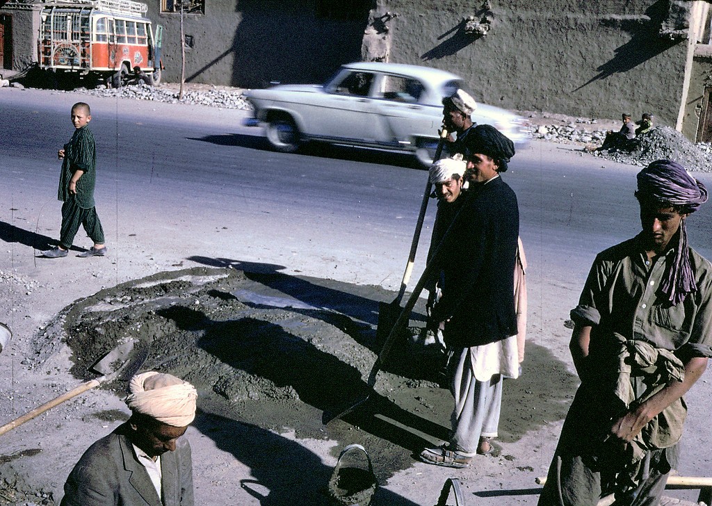 afghan workers make a street repair in kabul