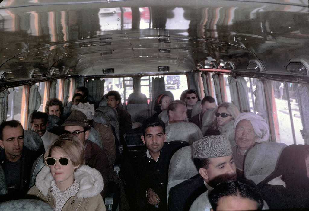 peg podlich in the sun glasses taking a family trip on a bus going from kabul afghanistan to peshawar pakistan