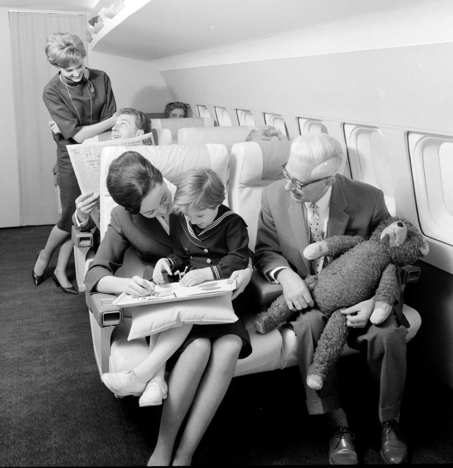 a couple flying first class in 1960s