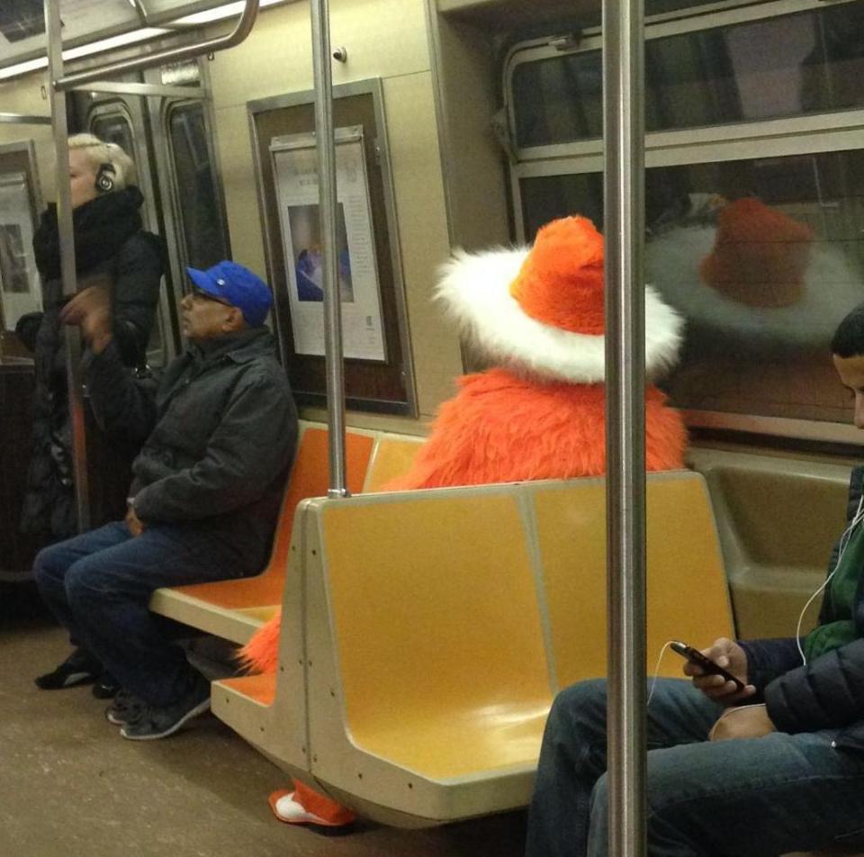 orange man on train