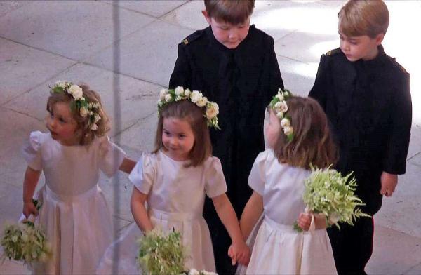 as meghan markle walked down the aisle to wed prince harry she was followed by her adorable flower girls including princes charlotte centre and page boys