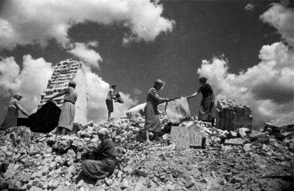 soviet women clearing away the debris in bomb ravaged cities bw