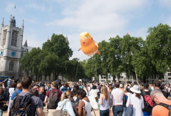 a giant blimp depicting us president donald trump as a baby in a nappy