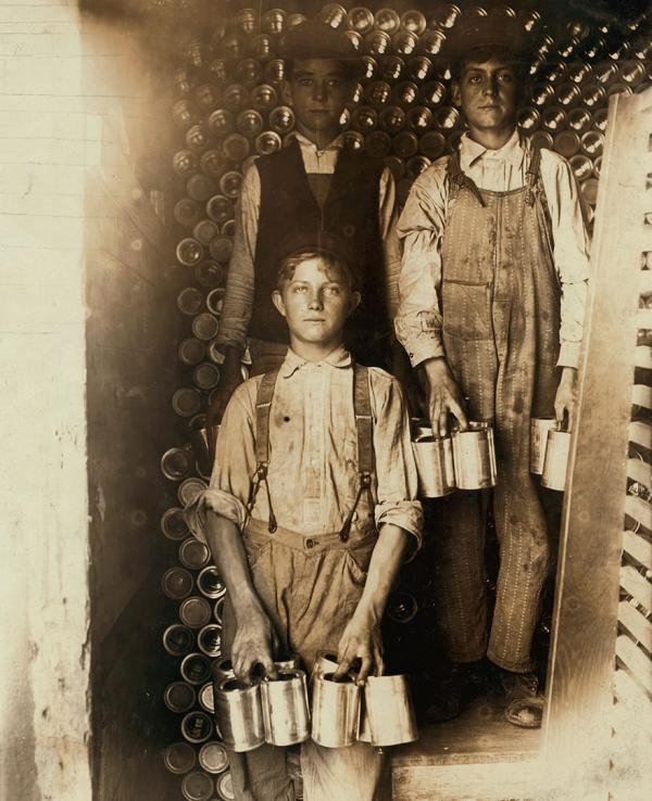 boys working in a cannery indianapolis unloading freight cars full of new tomato cans