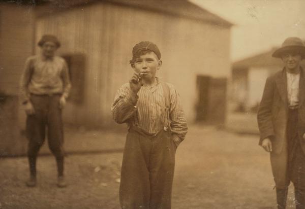 john tidwell a cotton mill product doffer in avondale mills many of these youngsters smoke