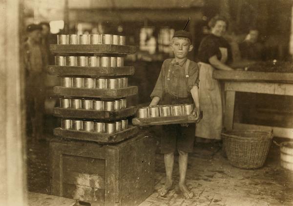 one of the small boys in j s farrand packing co and a heavy load