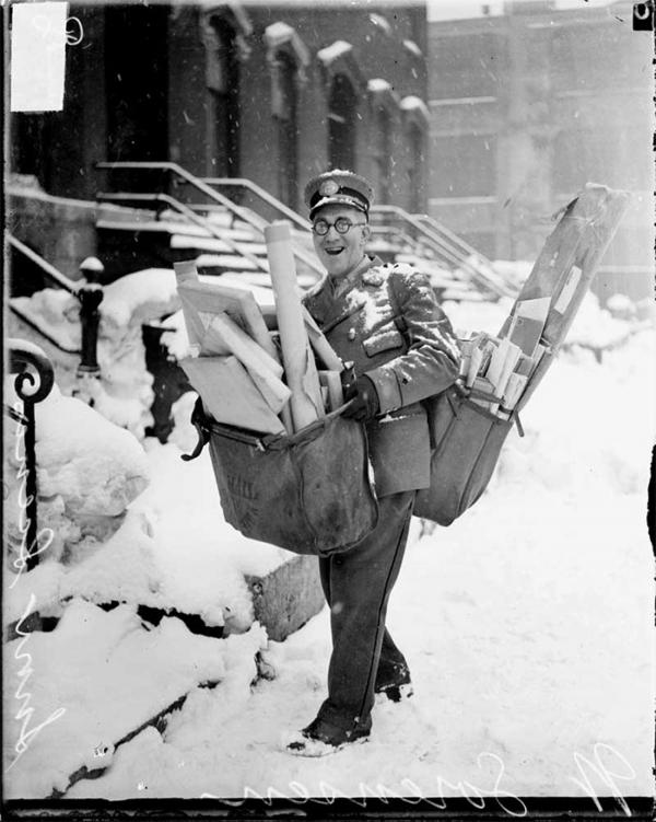 mailman poses with his heavy load of christmas mail and parcels chicago 1929