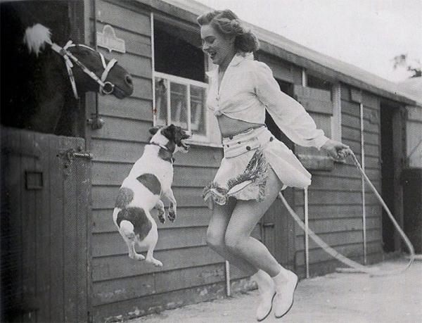 woman and dog jumping rope 1940s