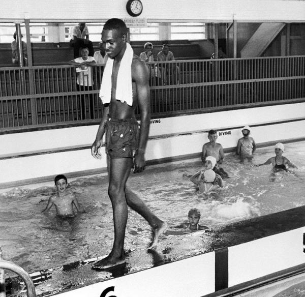 young david isom exceeds the color dividing line in one of the public pools of his city on june 8 1958 as a result the pool was closed to blacks by the authorities