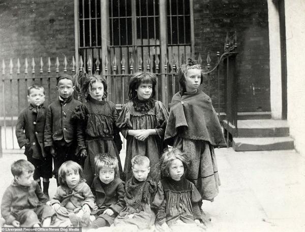 7278308 6482963 malnourished children stand outside the liverpool society for th a 2 1544548410336