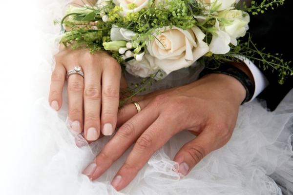 3 close up of newlywed couple holding rose bouquet