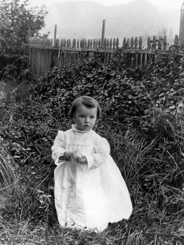 girl standing in garden 1900s black white kids mark goebel