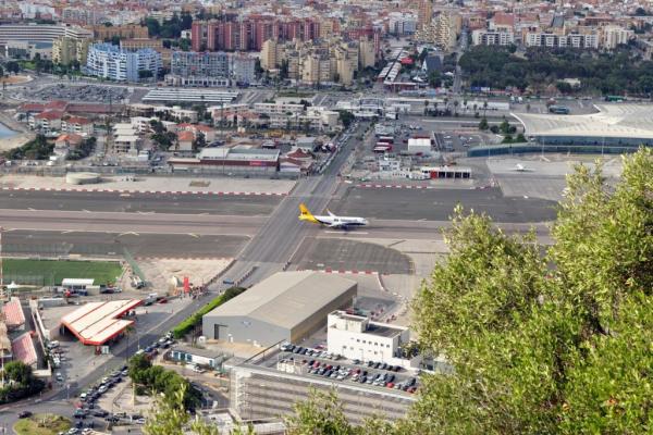 gibraltar august 29 2017 city of gibraltar the airport runway with a landed monarch airplane and la linea de la concepcion in spain 1024x684