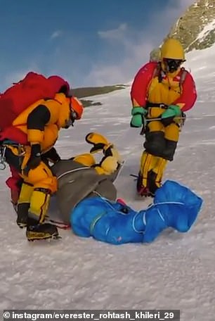 14090202 7081579 the sherpas pull the body over the ice a 61 1559122177544