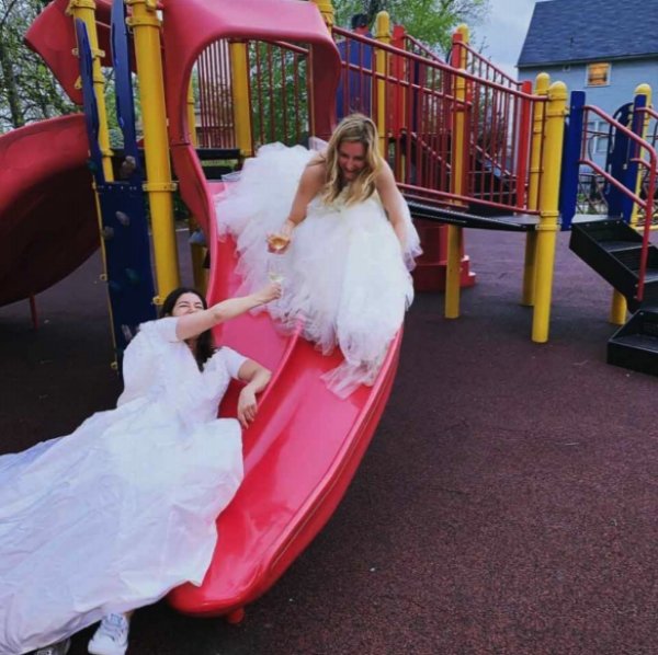 two girls wear wedding dresses out after divorce1