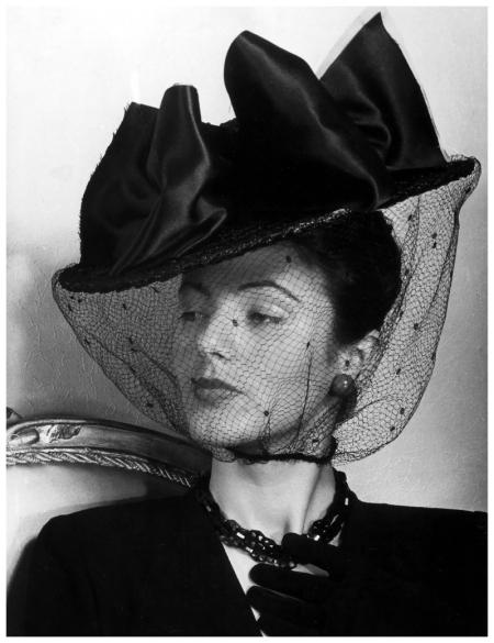 model in veiled black straw hat photo by regina relang berlin 1943
