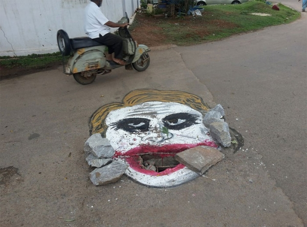 man draws attention to messed up roads in best way possible xx photos 5